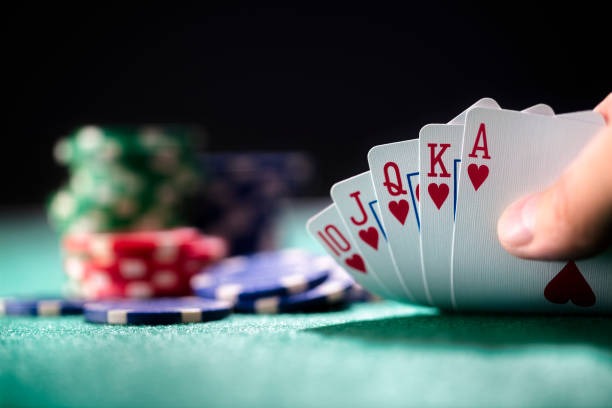 Mobile phone showing Mega Moolah stake controls and live dealer feed